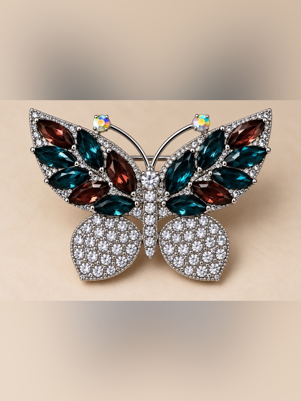 Crystal Butterfly Brooch with Teal and Garnet Accents